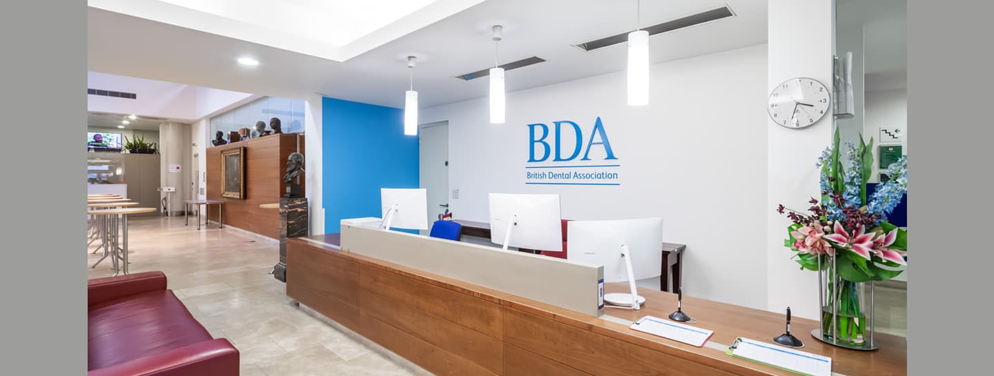 About us Hero 1440X545px NEWS AW The reception at the BDA's headquarters, with the logo on the wall behind the desk.