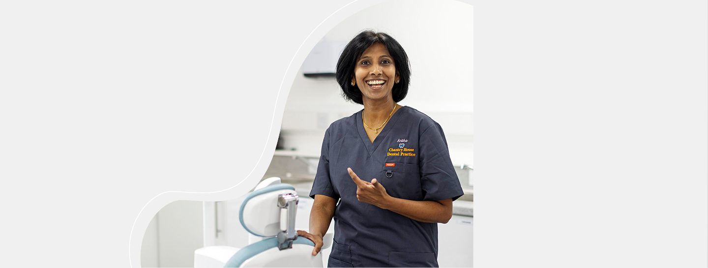 Overseas Qualified Advice A female dentist in her practice smiling into the camera
